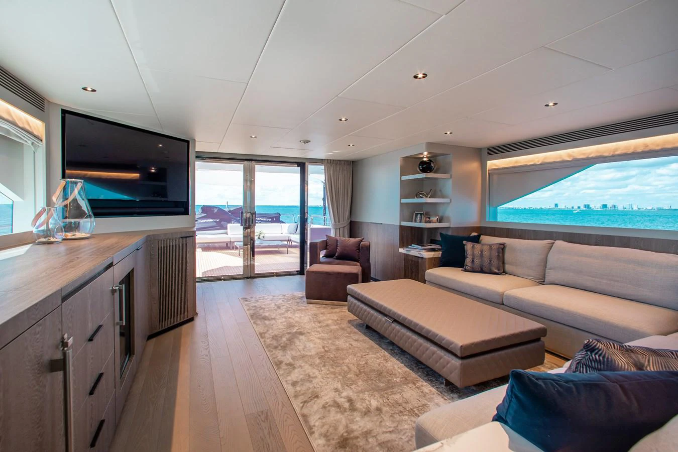 a living room with a large window aboard CROWNED EAGLE Yacht for Sale