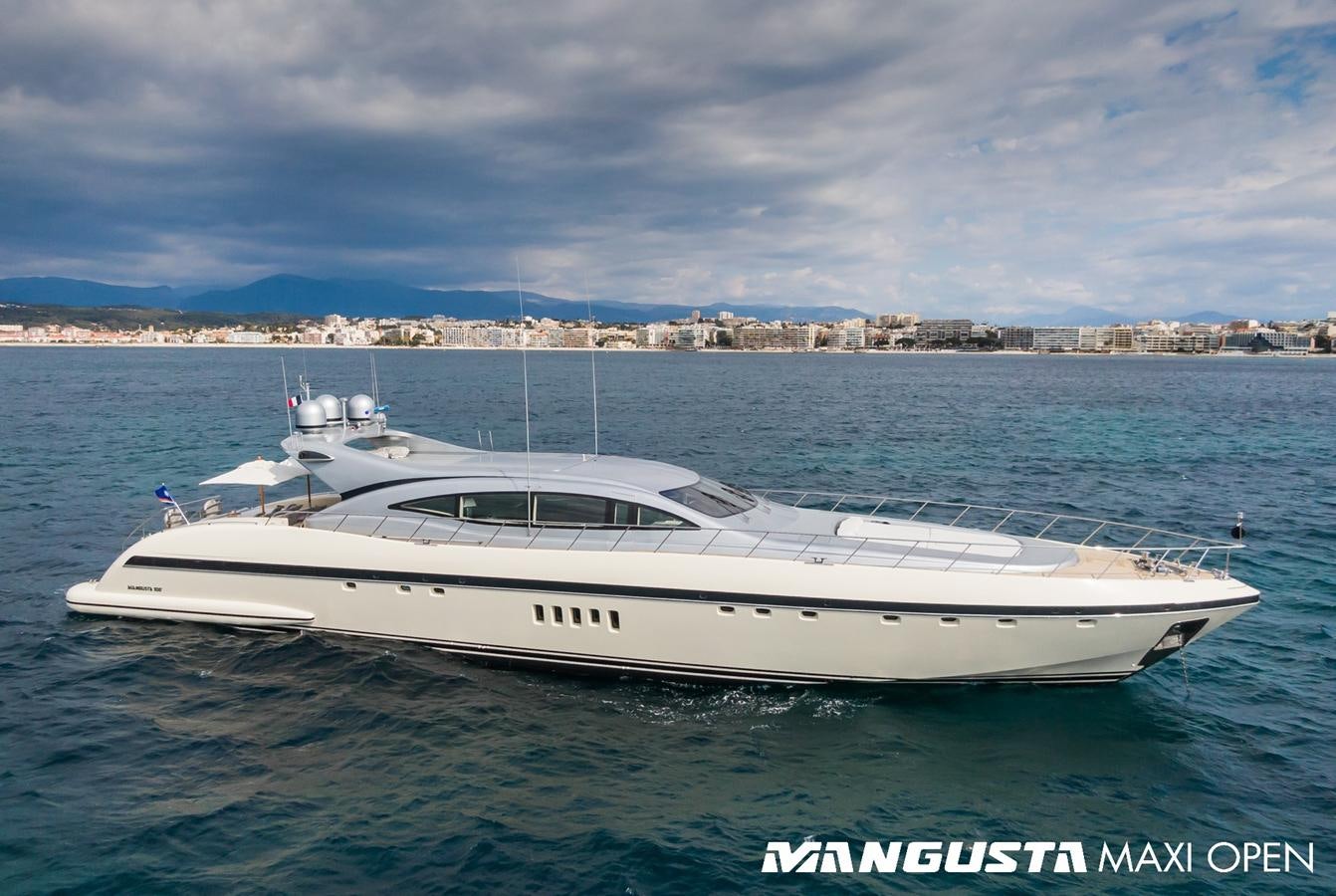 a white yacht in the water aboard MANGUSTA MAXI OPEN 108#23 - TECHNOMARINE - CAREFULLY USED Yacht for Sale
