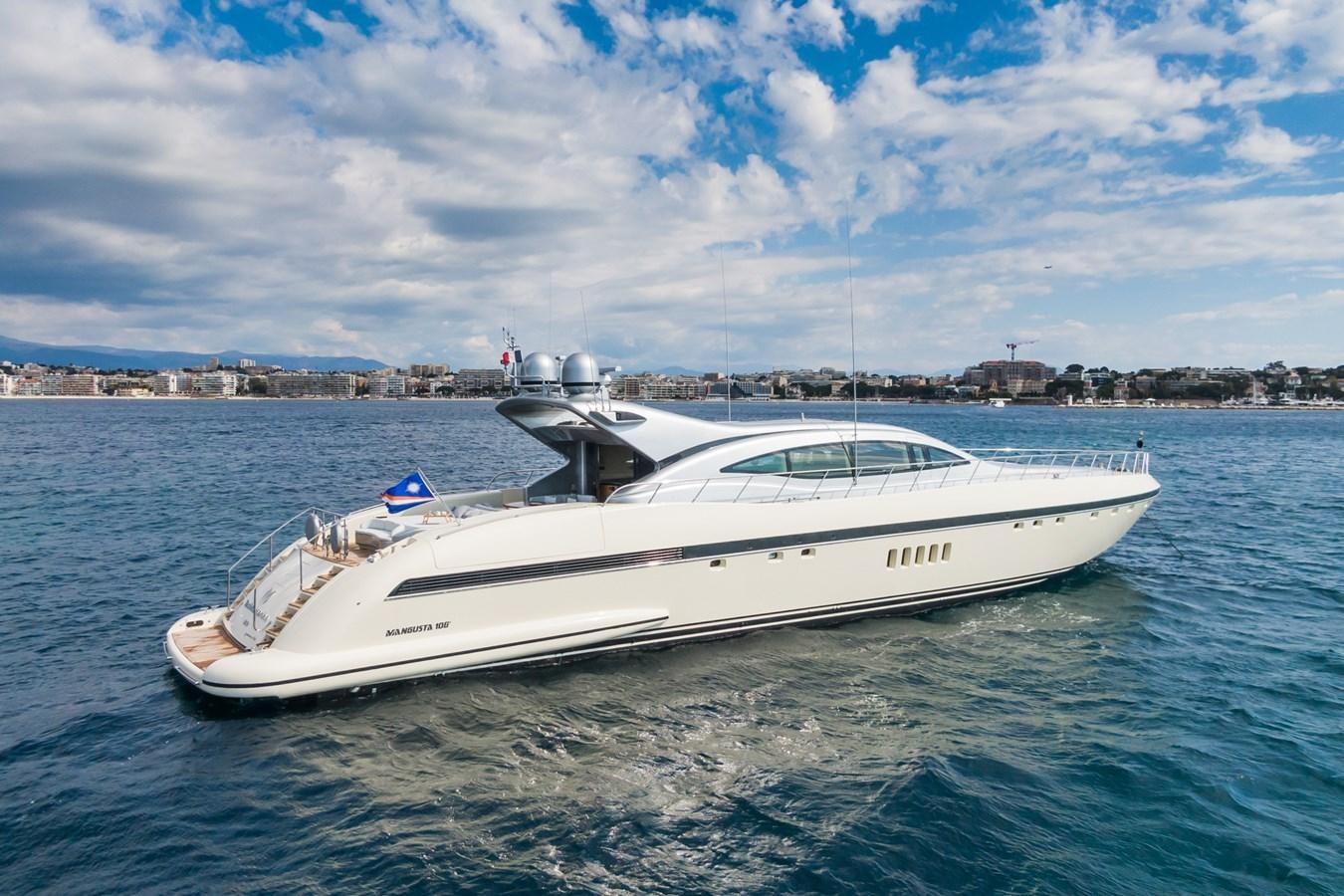 a white boat in the water aboard MANGUSTA MAXI OPEN 108#23 - TECHNOMARINE - CAREFULLY USED Yacht for Sale