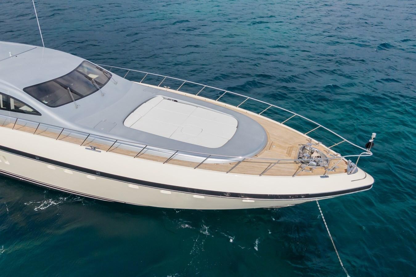 a white boat in the water aboard MANGUSTA MAXI OPEN 108#23 - TECHNOMARINE - CAREFULLY USED Yacht for Sale