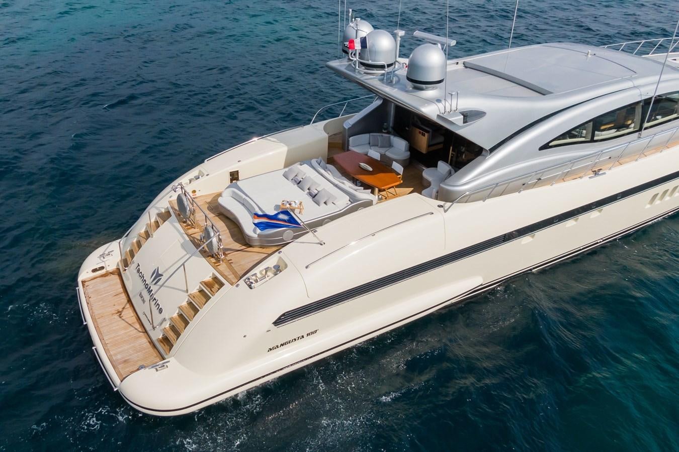 a white boat on the water aboard MANGUSTA MAXI OPEN 108#23 - TECHNOMARINE - CAREFULLY USED Yacht for Sale