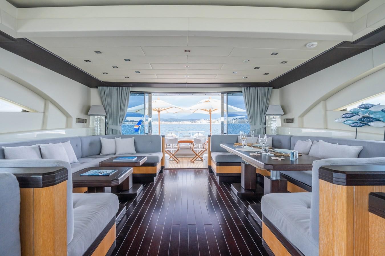 a living room with a large window aboard MANGUSTA MAXI OPEN 108#23 - TECHNOMARINE - CAREFULLY USED Yacht for Sale