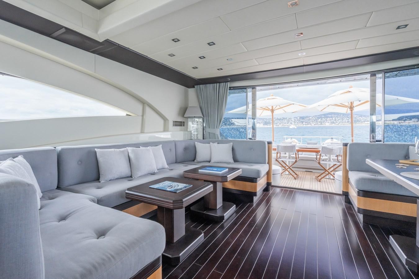 a living room with a large deck aboard MANGUSTA MAXI OPEN 108#23 - TECHNOMARINE - CAREFULLY USED Yacht for Sale