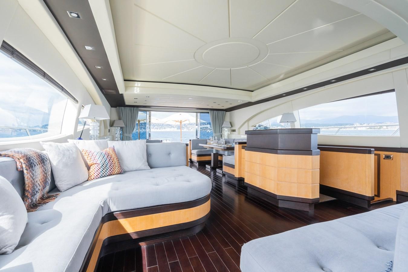 a room with a bed and a couch aboard MANGUSTA MAXI OPEN 108#23 - TECHNOMARINE - CAREFULLY USED Yacht for Sale