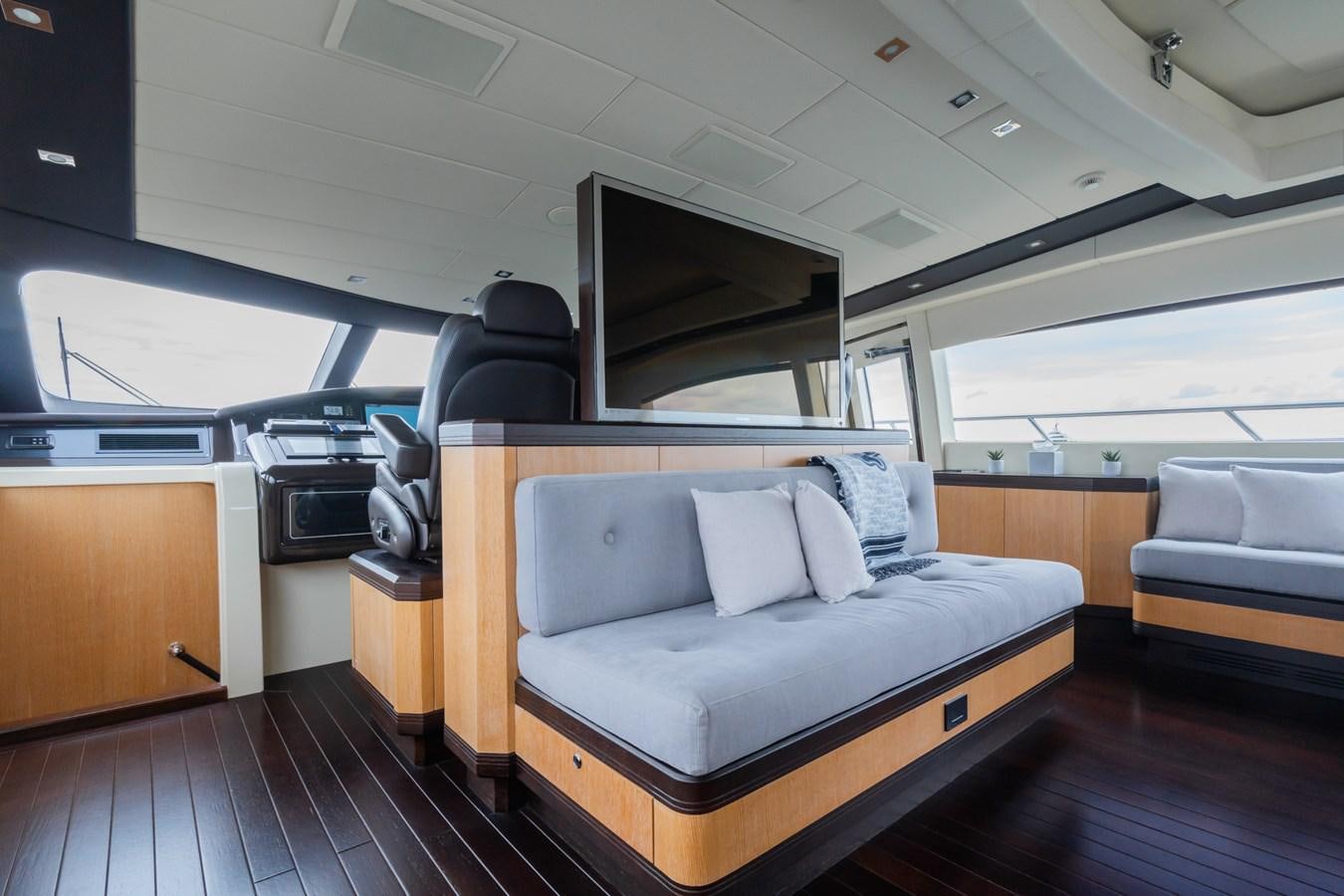 a room with a bed and a couch aboard MANGUSTA MAXI OPEN 108#23 - TECHNOMARINE - CAREFULLY USED Yacht for Sale