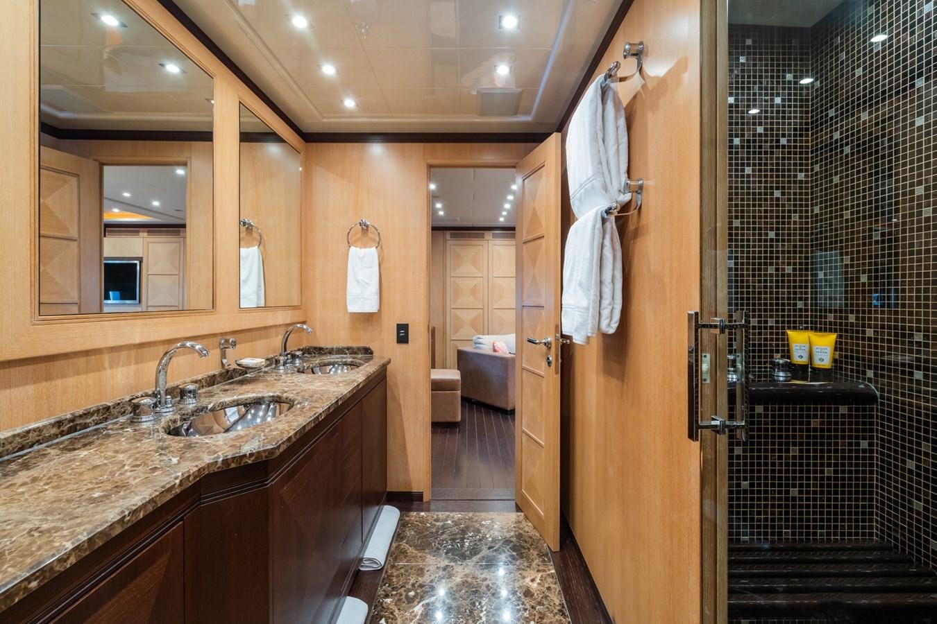 a bathroom with a sink and a mirror aboard MANGUSTA MAXI OPEN 108#23 - TECHNOMARINE - CAREFULLY USED Yacht for Sale