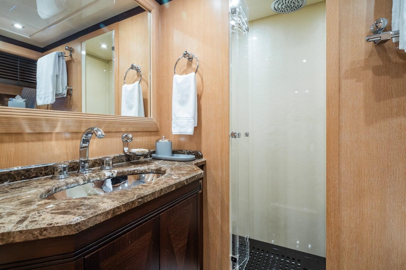 a bathroom with a sink and a mirror aboard MANGUSTA MAXI OPEN 108#23 - TECHNOMARINE - CAREFULLY USED Yacht for Sale
