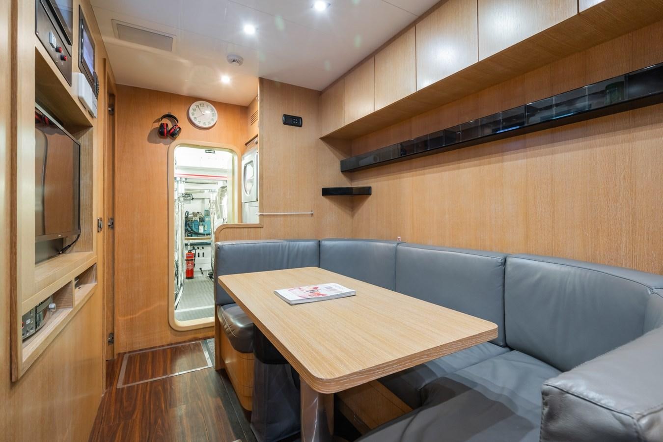 a living room with a couch and a table aboard MANGUSTA MAXI OPEN 108#23 - TECHNOMARINE - CAREFULLY USED Yacht for Sale