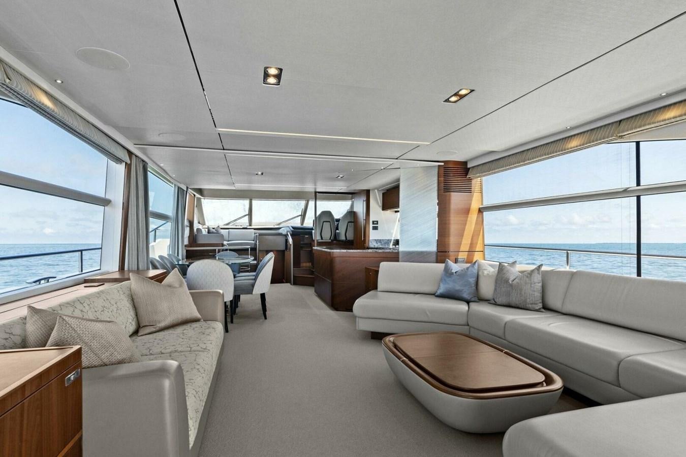 a living room with a large window aboard AMARULA SUN Yacht for Sale