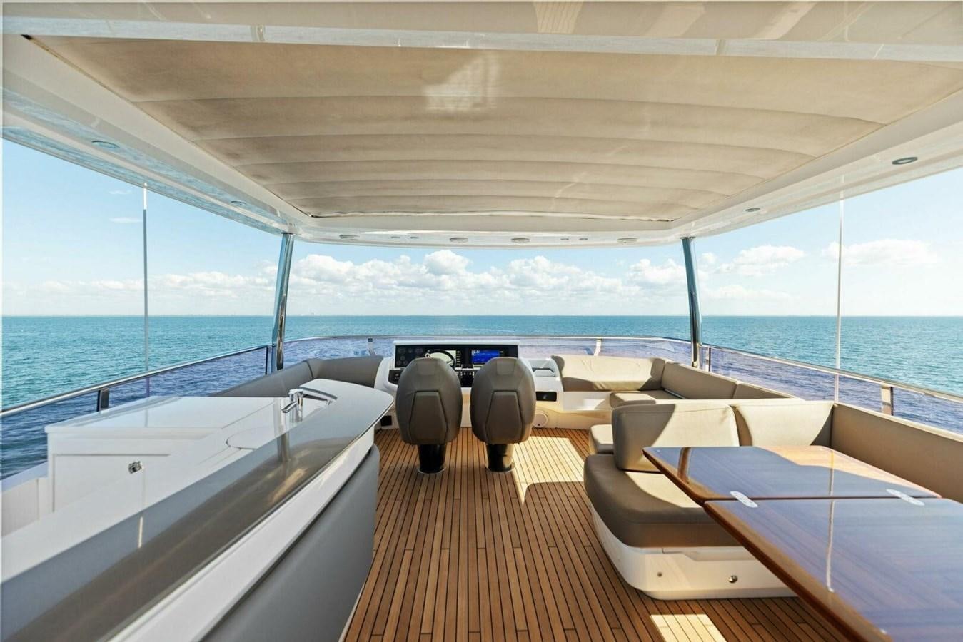 a boat with a deck and chairs aboard AMARULA SUN Yacht for Sale