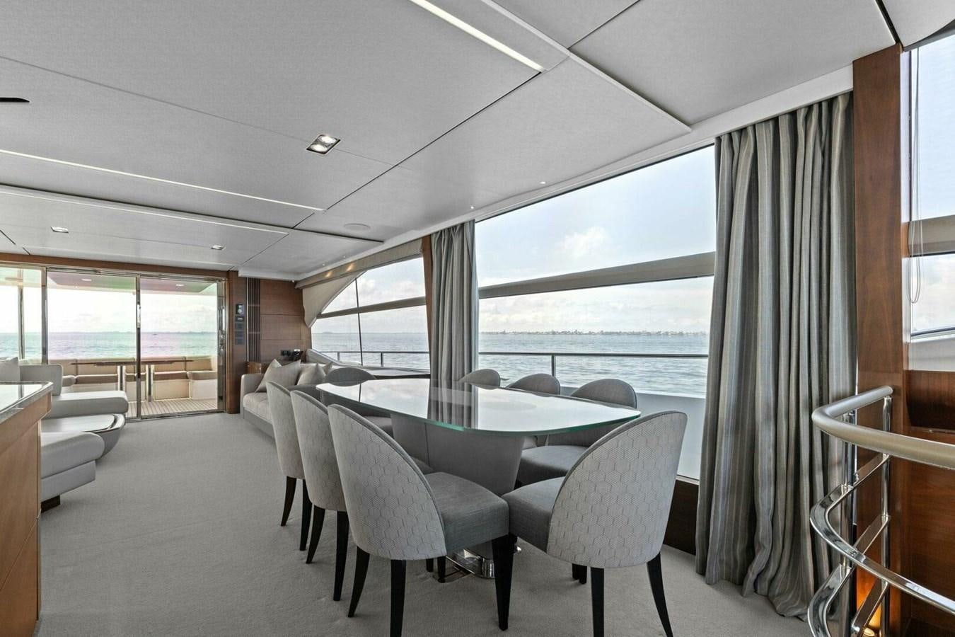 a room with a table and chairs aboard AMARULA SUN Yacht for Sale