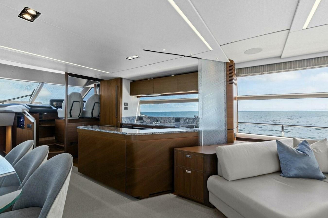 a room with a couch and a table aboard AMARULA SUN Yacht for Sale
