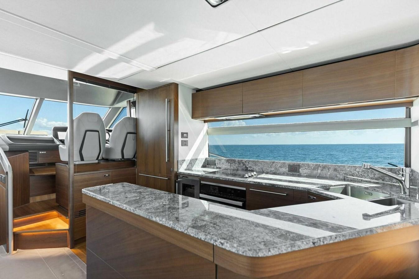 a kitchen with a large glass window aboard AMARULA SUN Yacht for Sale