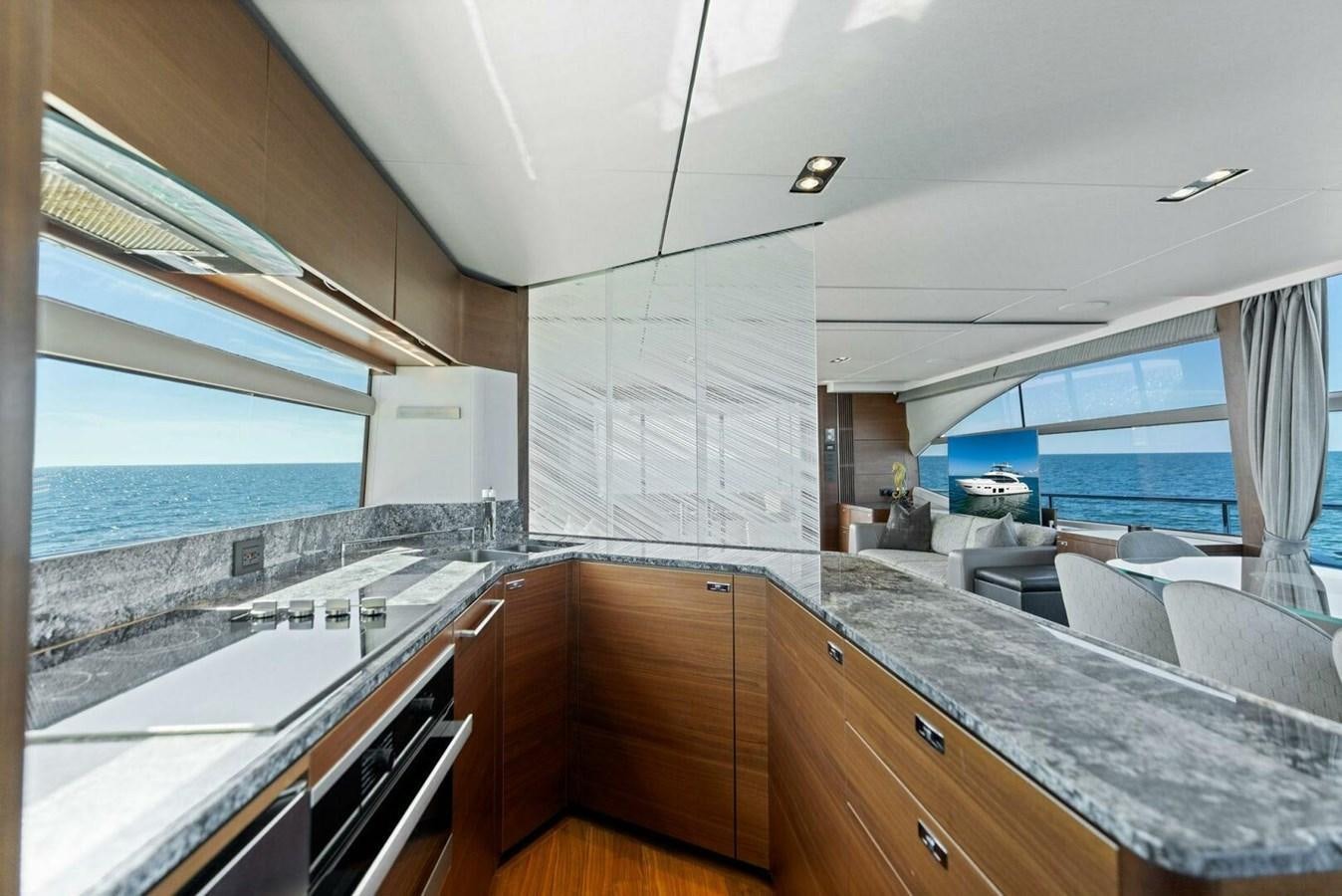 a kitchen with a large island aboard AMARULA SUN Yacht for Sale