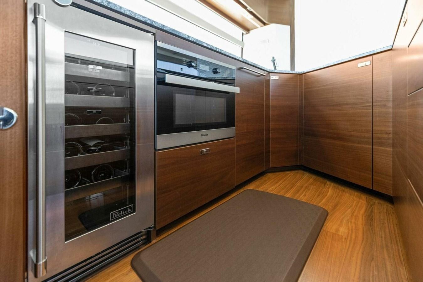 a kitchen with stainless steel appliances aboard AMARULA SUN Yacht for Sale