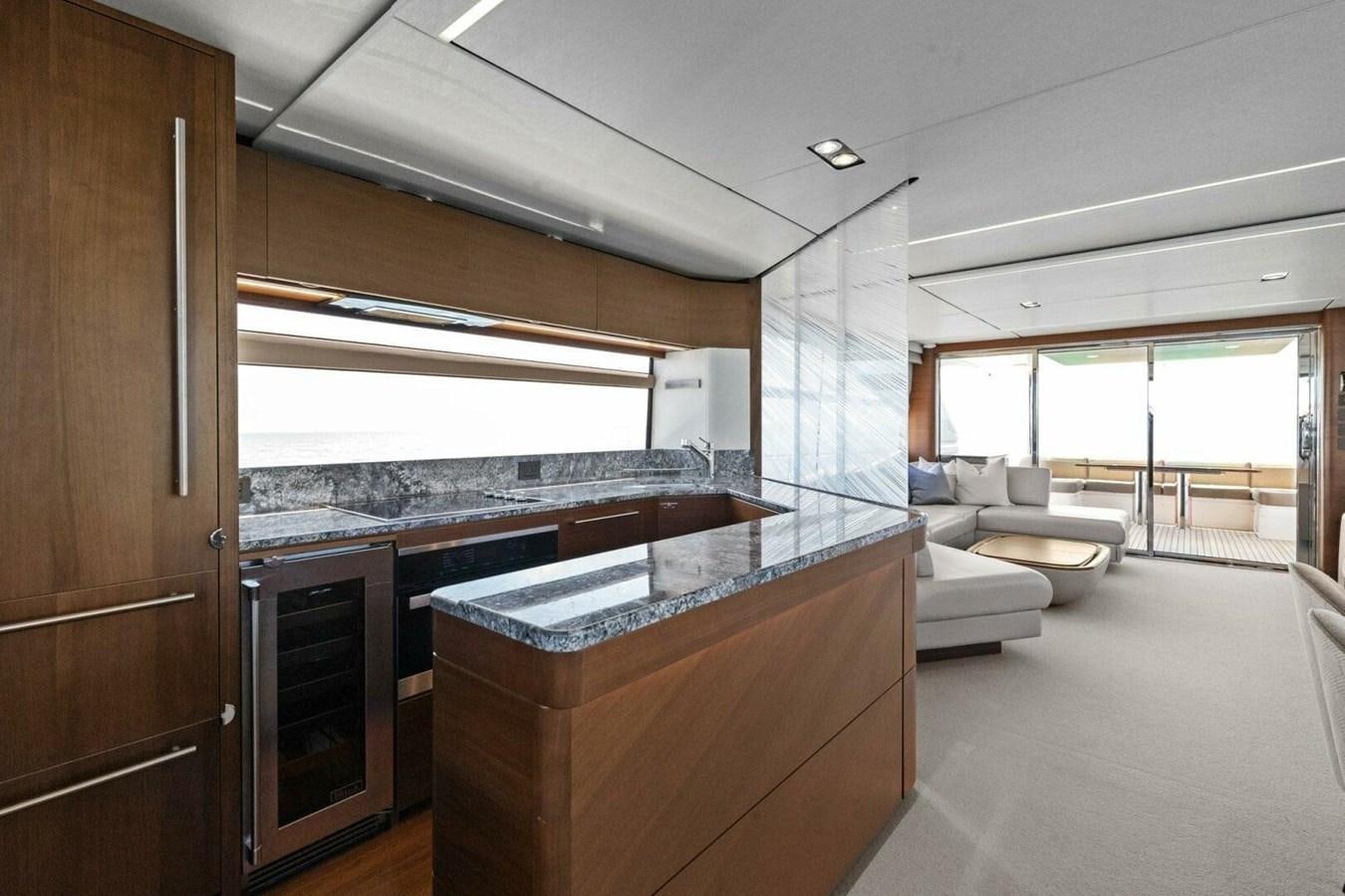 a kitchen with a large island aboard AMARULA SUN Yacht for Sale