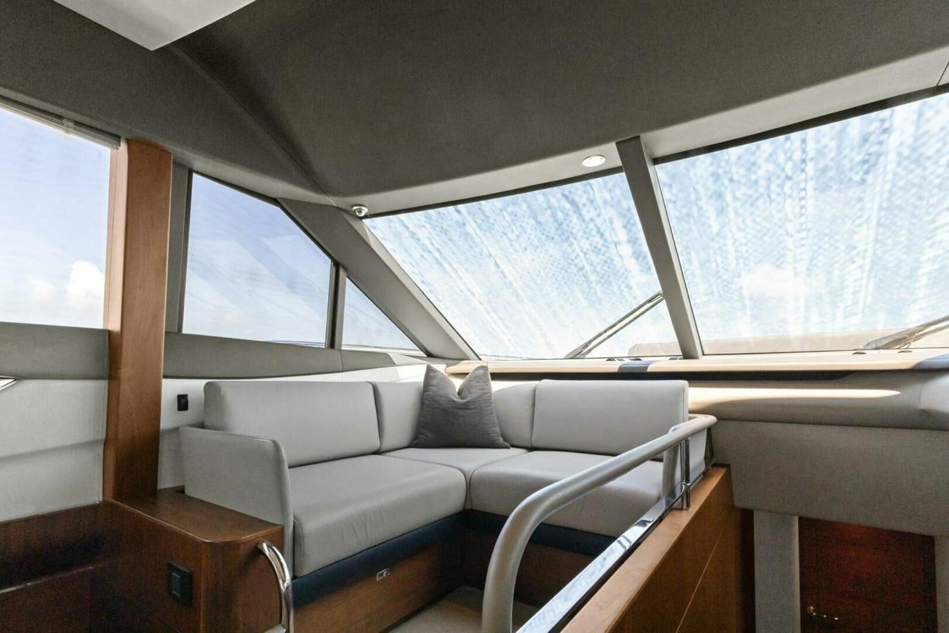 a room with a couch and a window aboard AMARULA SUN Yacht for Sale