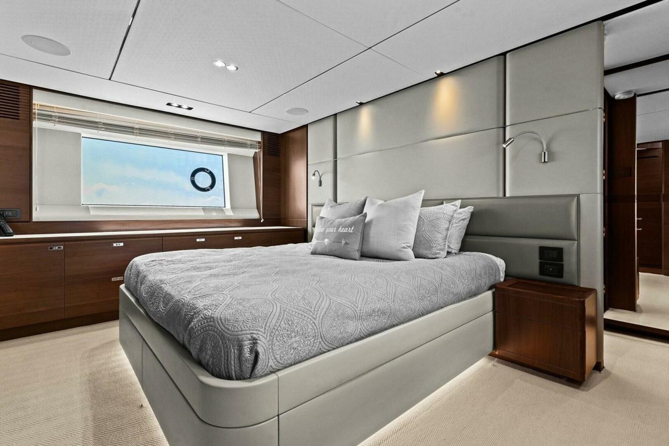 a bedroom with a bed and a television aboard AMARULA SUN Yacht for Sale