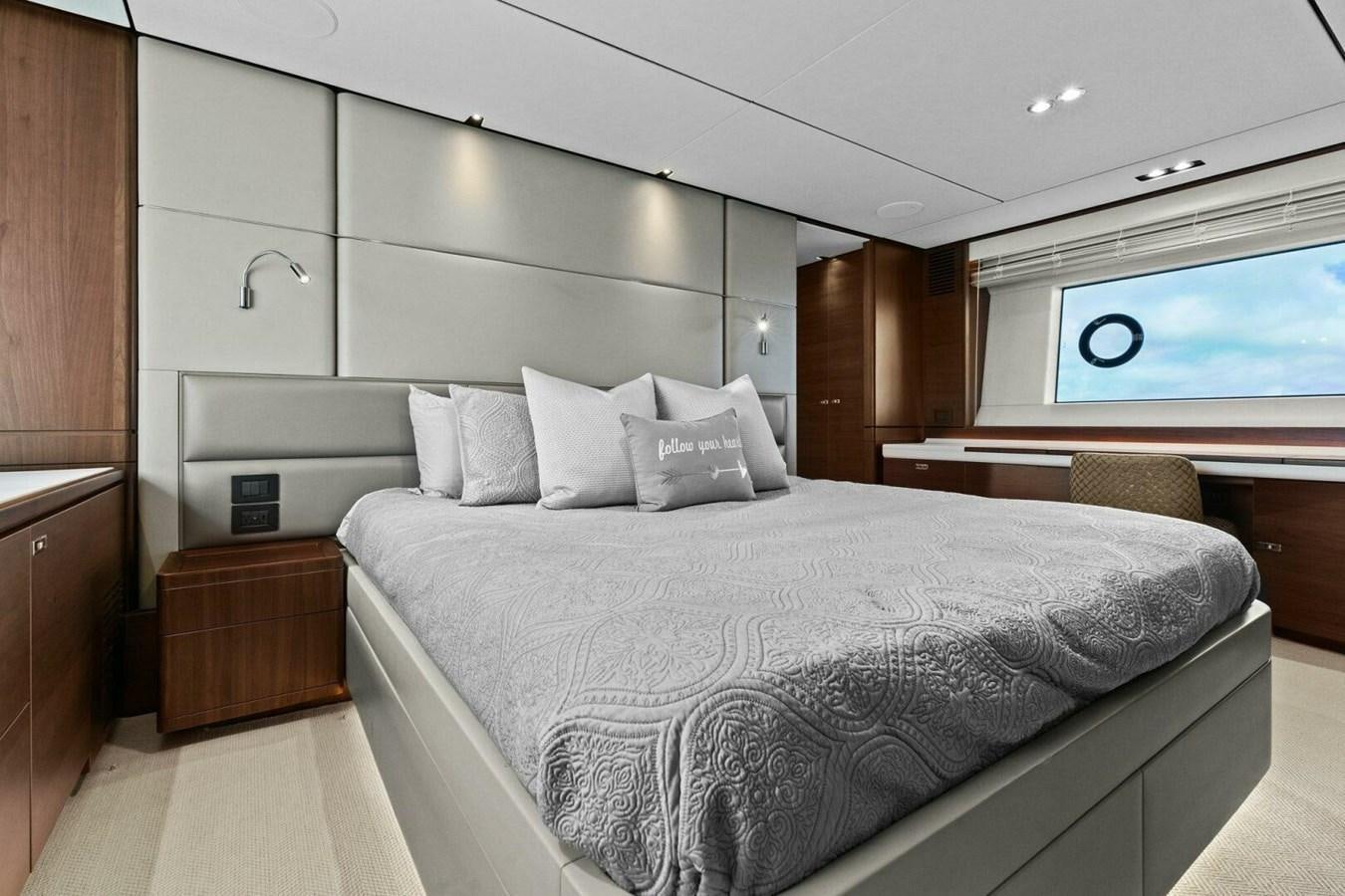 a bed with white sheets aboard AMARULA SUN Yacht for Sale