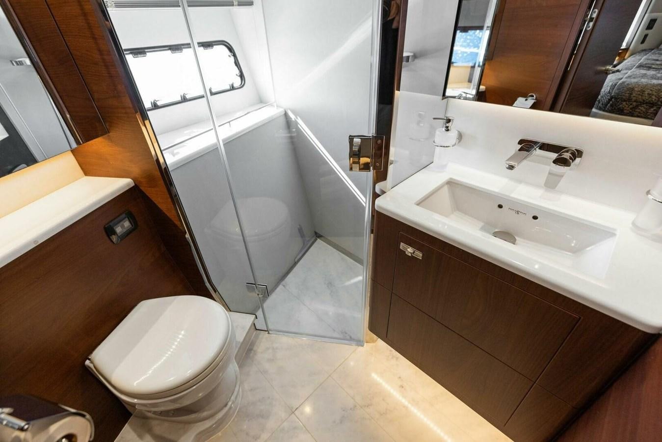 a bathroom with a toilet sink and a bathtub aboard AMARULA SUN Yacht for Sale