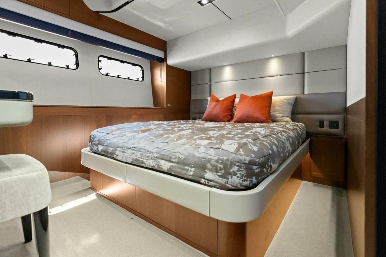 a bed in a room aboard AMARULA SUN Yacht for Sale