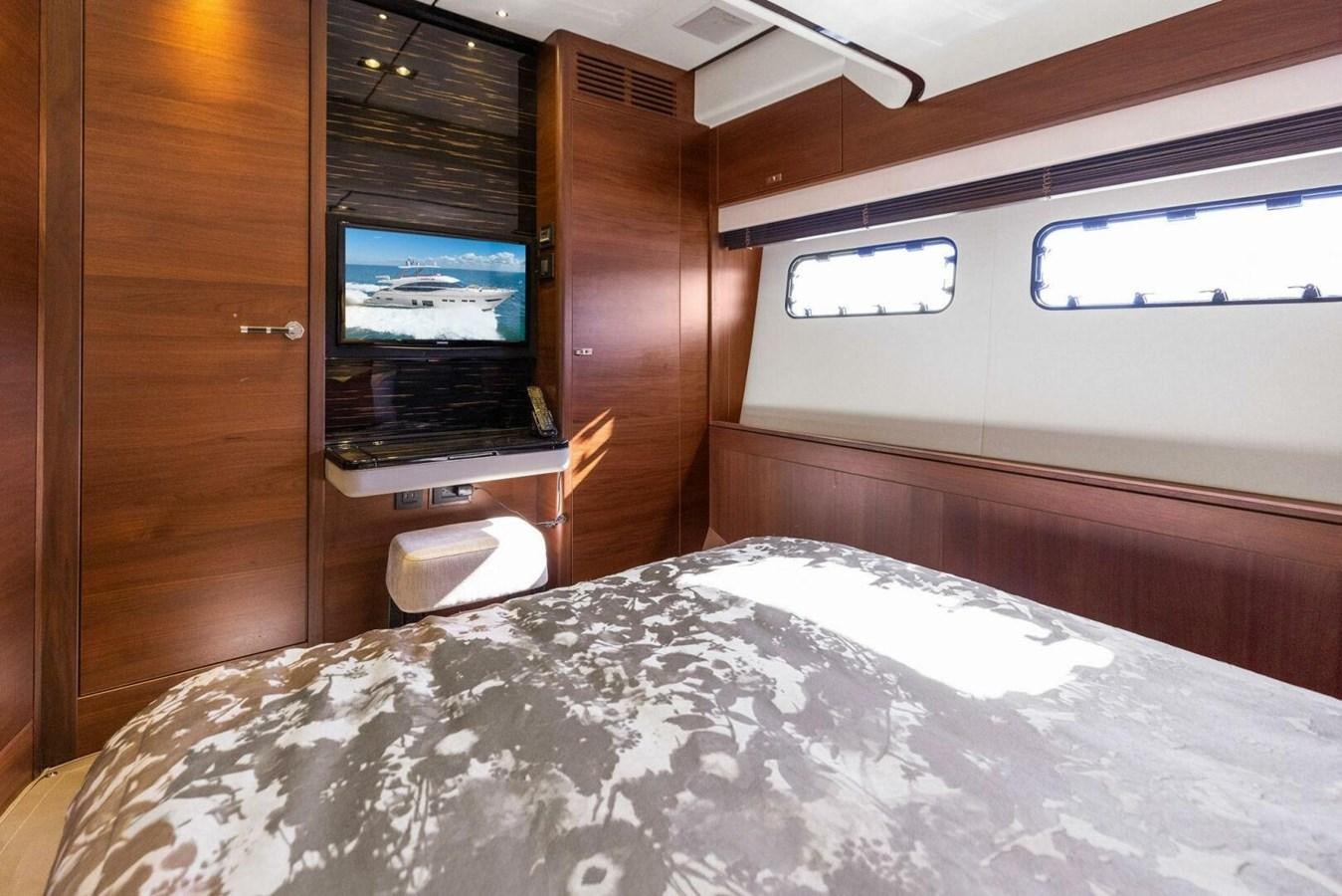 a bed with a laptop on it aboard AMARULA SUN Yacht for Sale