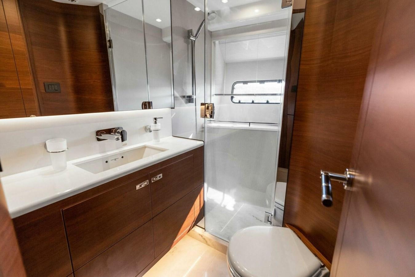 a bathroom with a shower and sink aboard AMARULA SUN Yacht for Sale