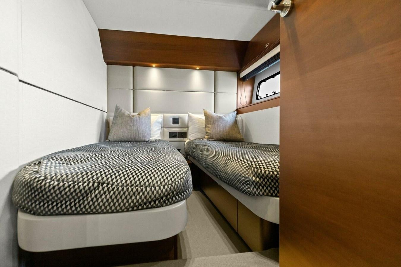 a couple of beds in a room aboard AMARULA SUN Yacht for Sale