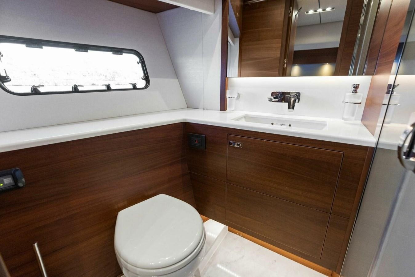 a bathroom with a toilet and a sink aboard AMARULA SUN Yacht for Sale