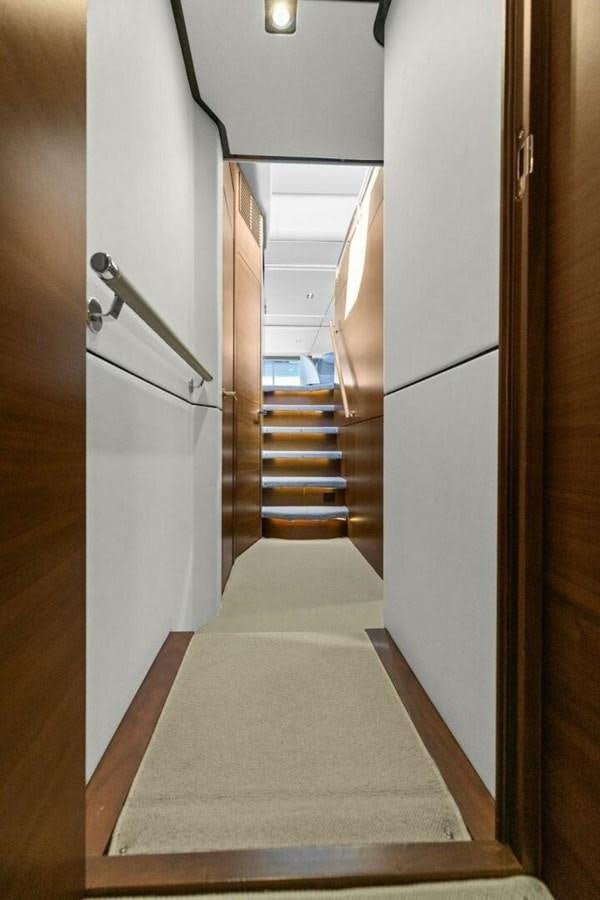 a white bed in a room aboard AMARULA SUN Yacht for Sale