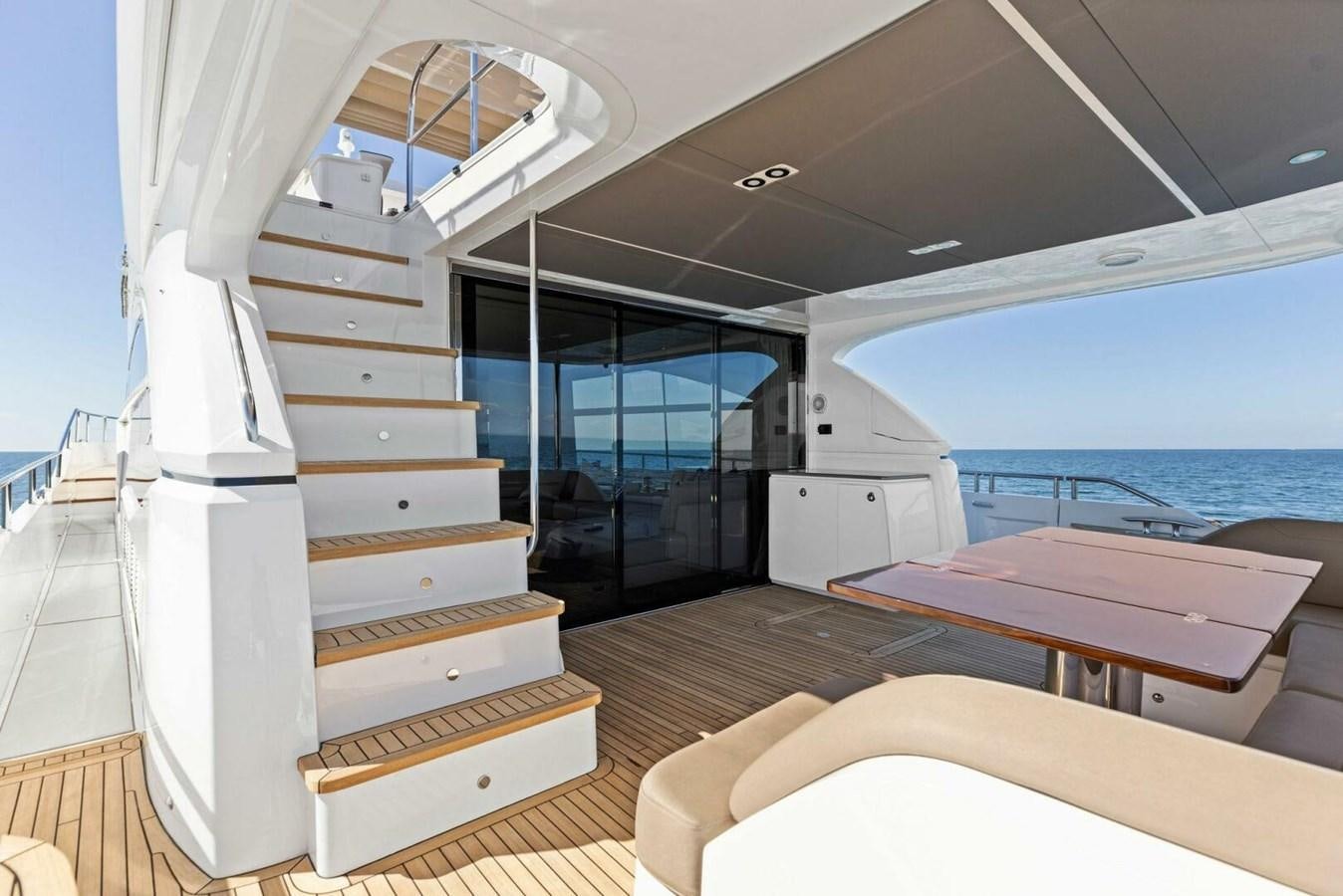 a staircase leading to a glass door aboard AMARULA SUN Yacht for Sale