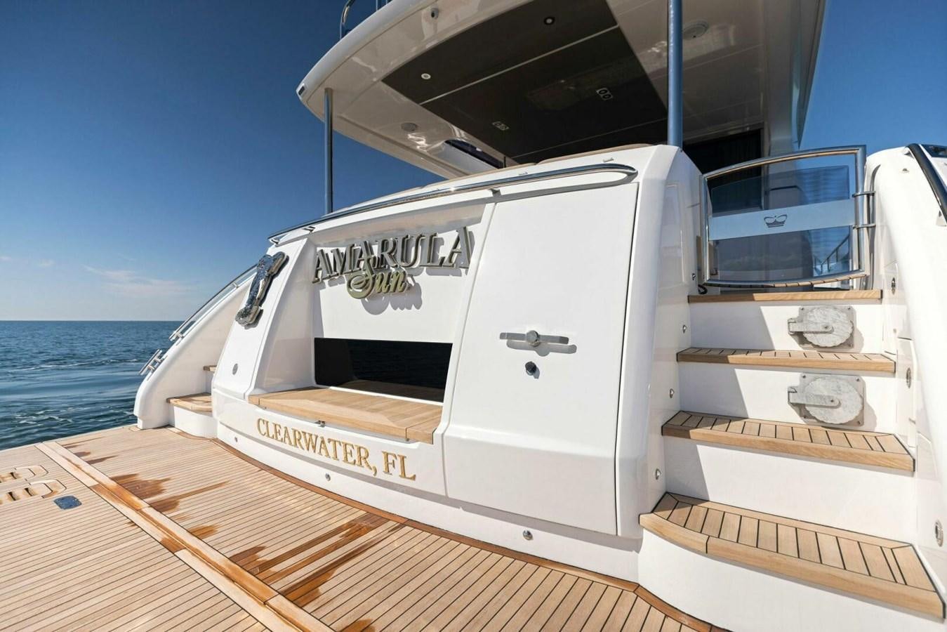 a white boat on a deck aboard AMARULA SUN Yacht for Sale