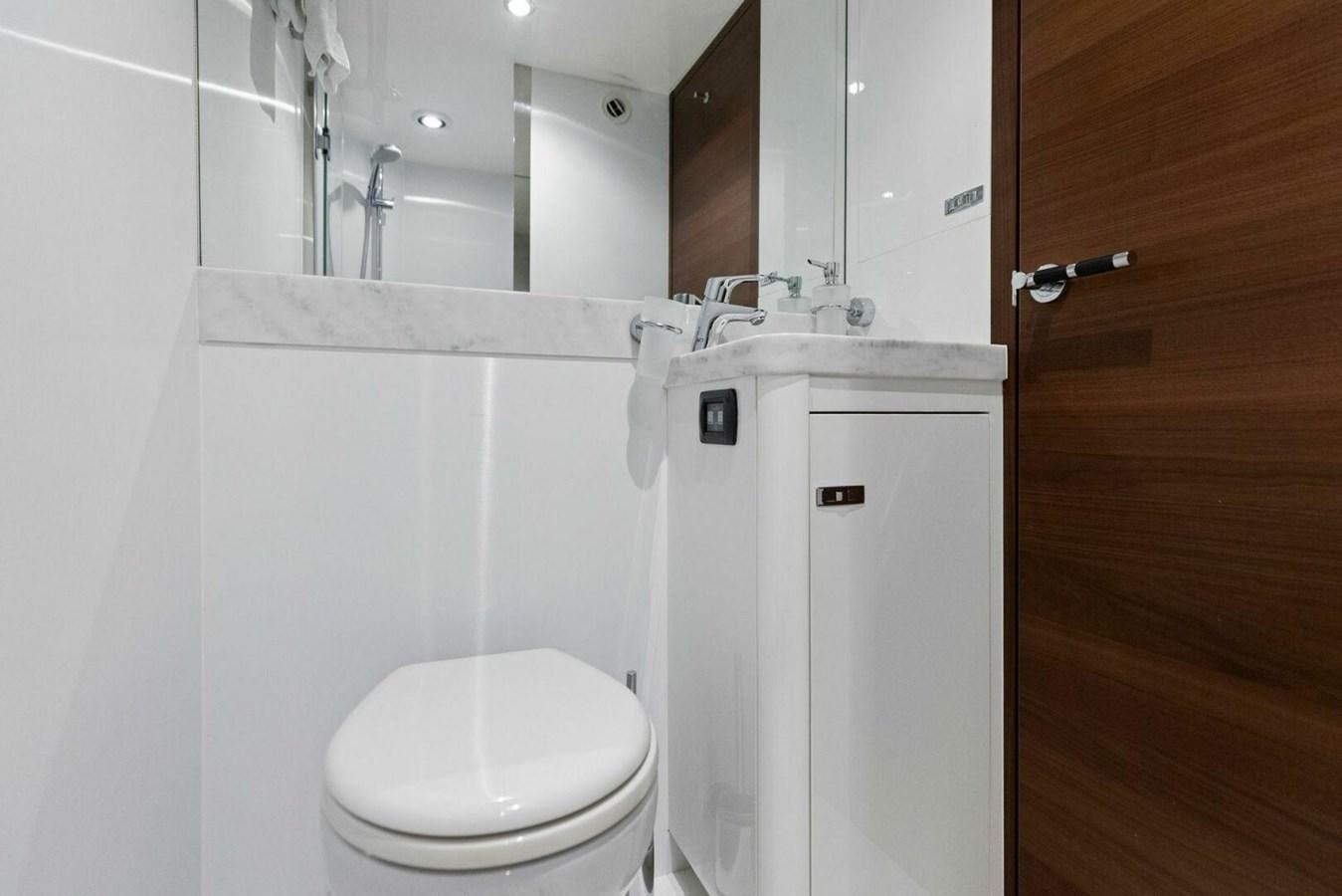 a bathroom with a toilet and a sink aboard AMARULA SUN Yacht for Sale