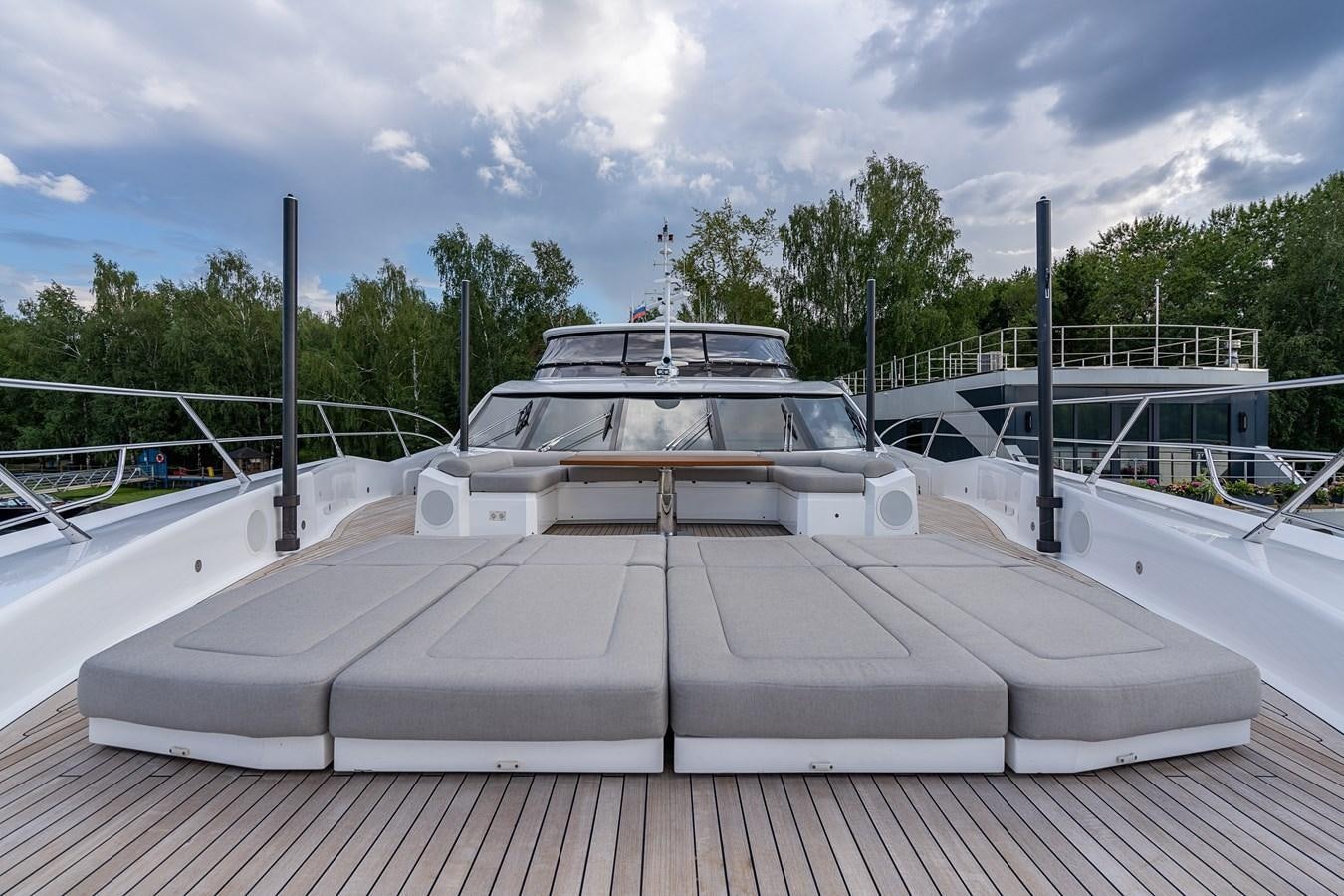 a white car on a deck aboard SUNSEEKER PREDATOR 115 Yacht for Sale