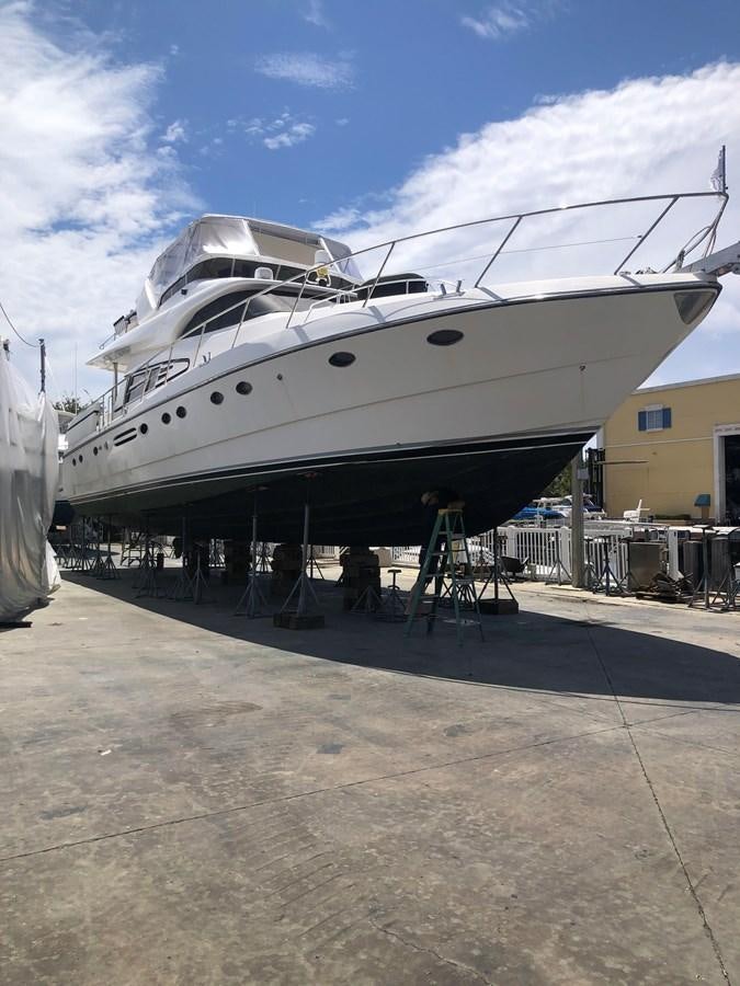 a boat parked in a dock aboard MADNESS Yacht for Sale