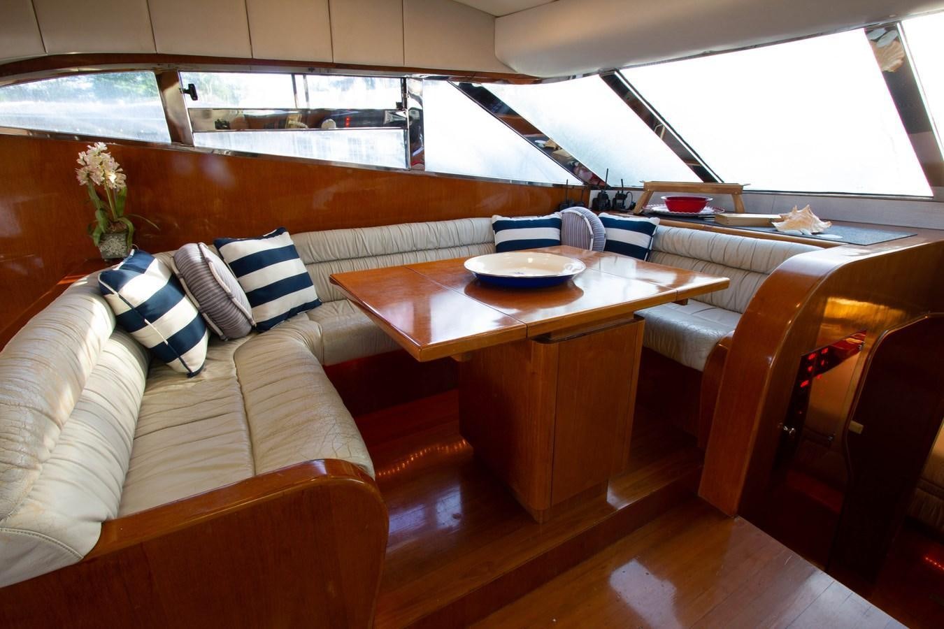 a table with a plate on it aboard MADNESS Yacht for Sale