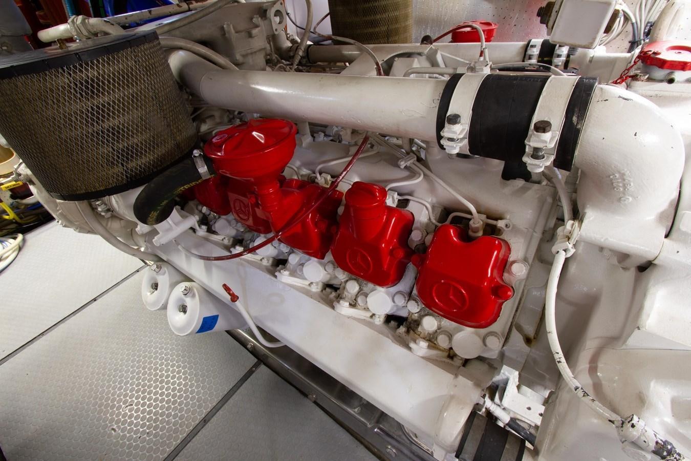a close-up of a car engine aboard MADNESS Yacht for Sale