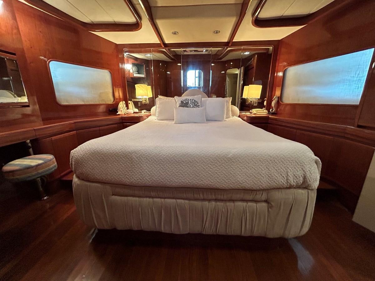 a bed in a cabin aboard MADNESS Yacht for Sale