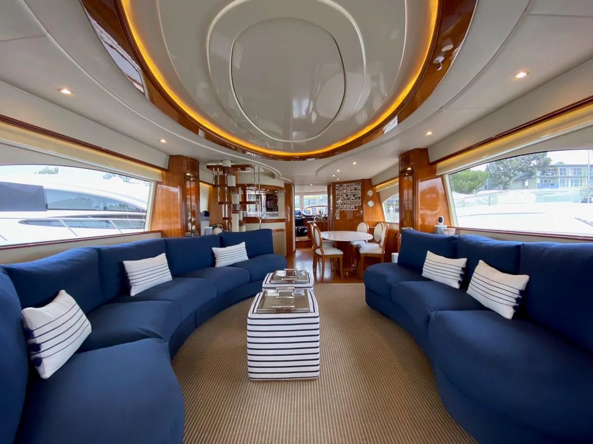 a large living room with a large chandelier aboard AZIMUT 100/32 Yacht for Sale