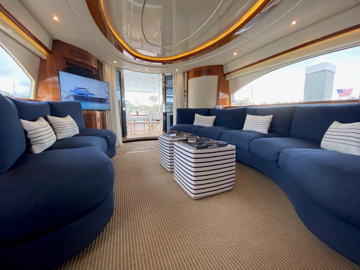 a large living room with a large chandelier aboard AZIMUT 100/32 Yacht for Sale