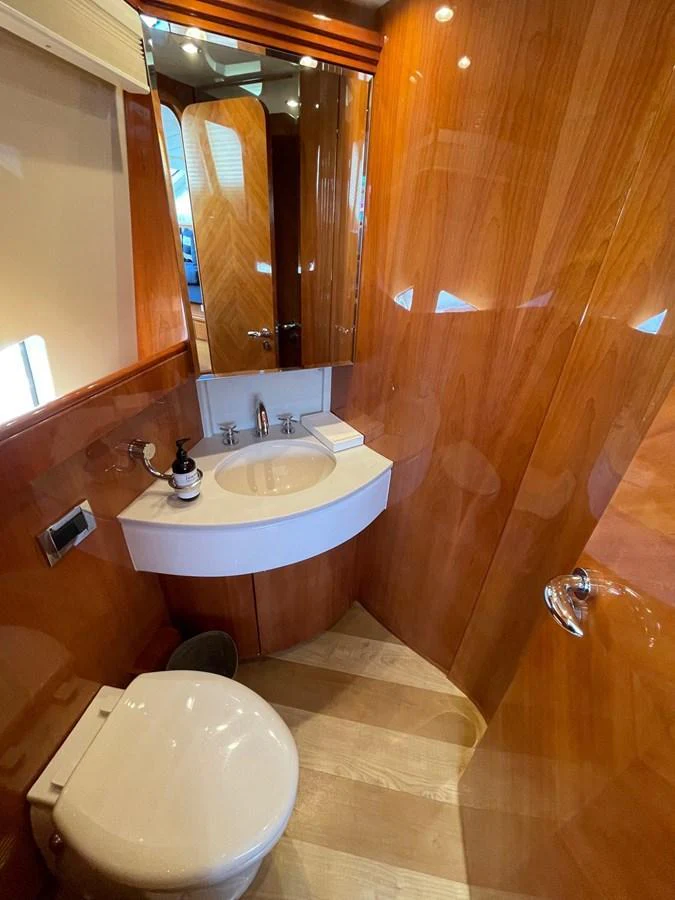 a bathroom with a toilet and a sink aboard AZIMUT 100/32 Yacht for Sale