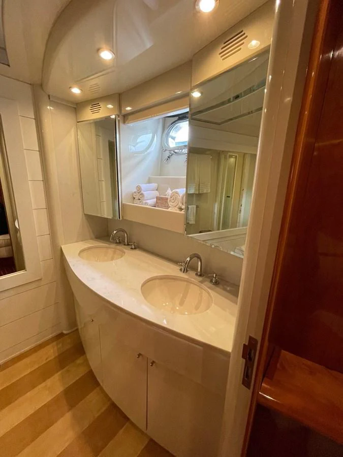 a bathroom with a large mirror aboard AZIMUT 100/32 Yacht for Sale