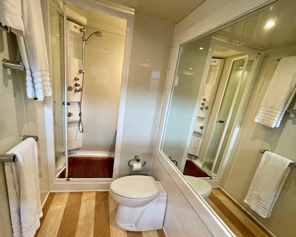 a bathroom with a glass shower aboard AZIMUT 100/32 Yacht for Sale