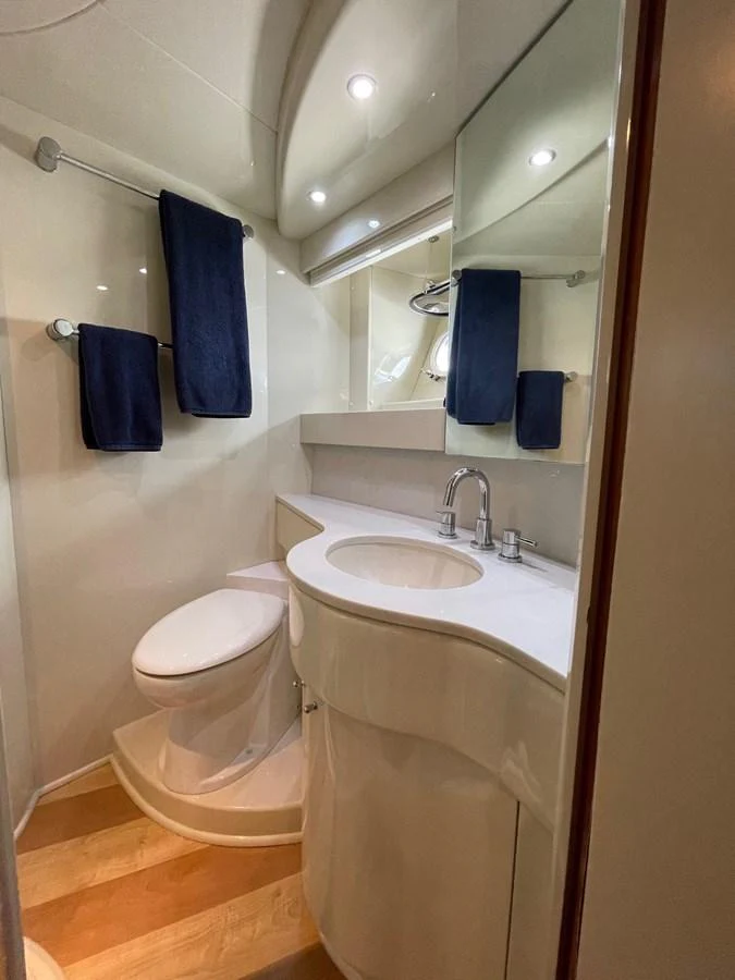 a bathroom with a sink and toilet aboard AZIMUT 100/32 Yacht for Sale
