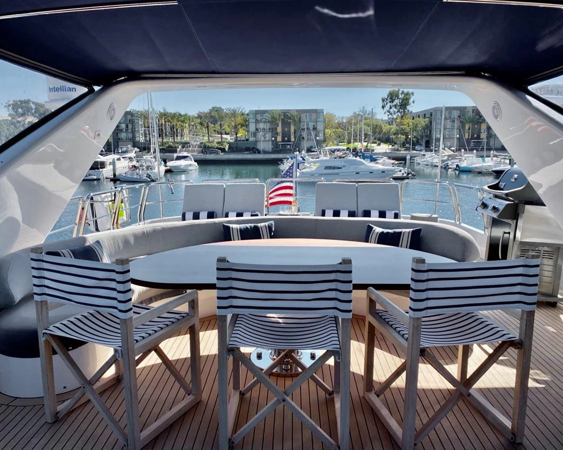 a table and chairs on a boat aboard AZIMUT 100/32 Yacht for Sale
