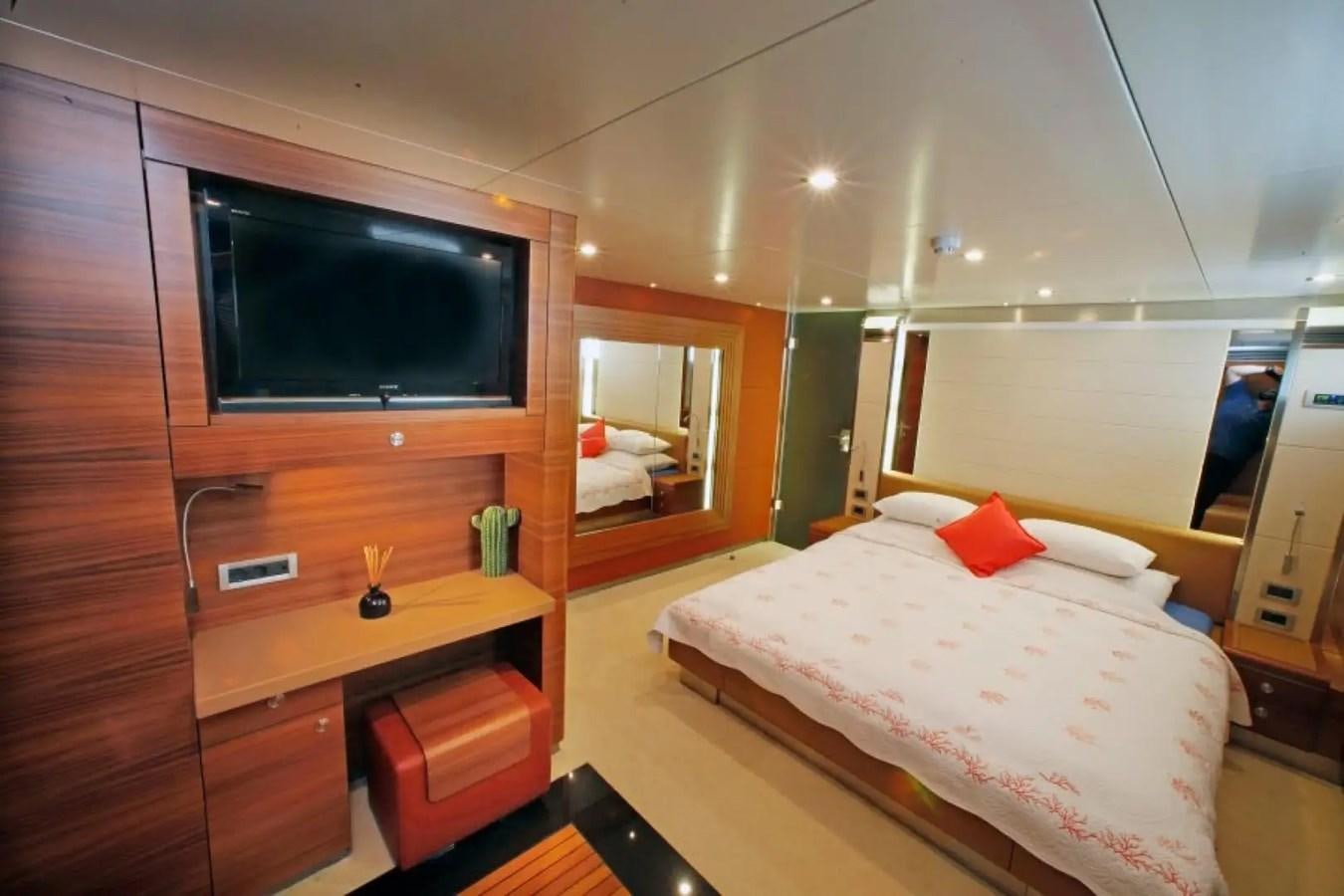 a bedroom with a bed and tv aboard DELETE MR MOUSE Yacht for Sale
