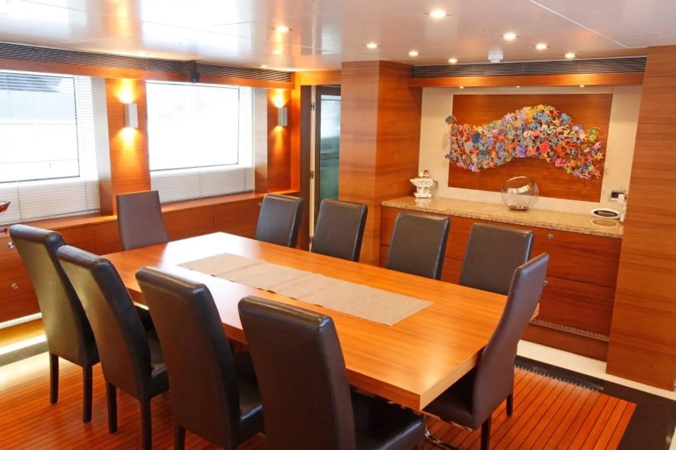 a large room with a table and chairs aboard DELETE MR MOUSE Yacht for Sale
