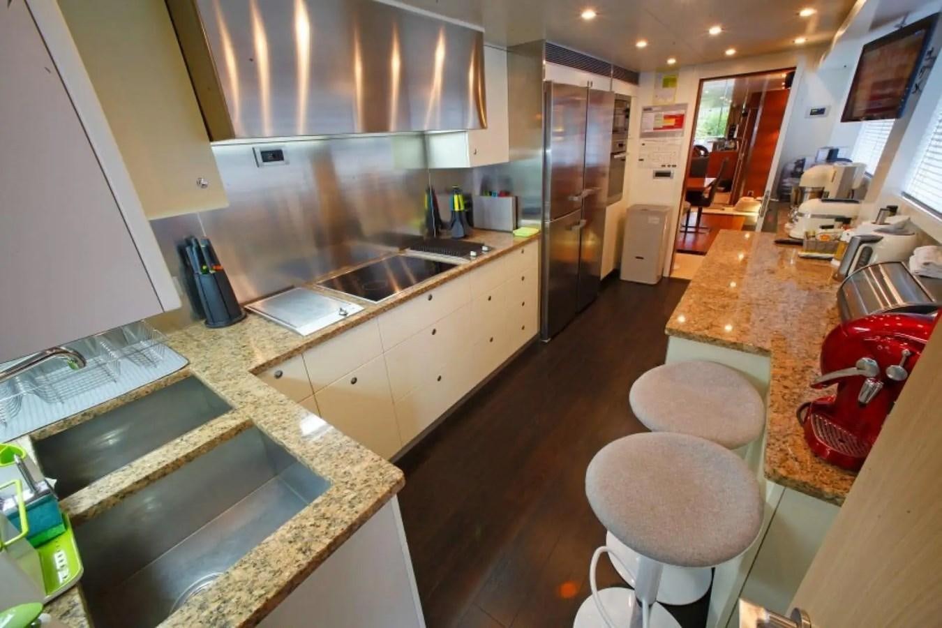 a kitchen with a countertop sink and a dishwasher aboard DELETE MR MOUSE Yacht for Sale