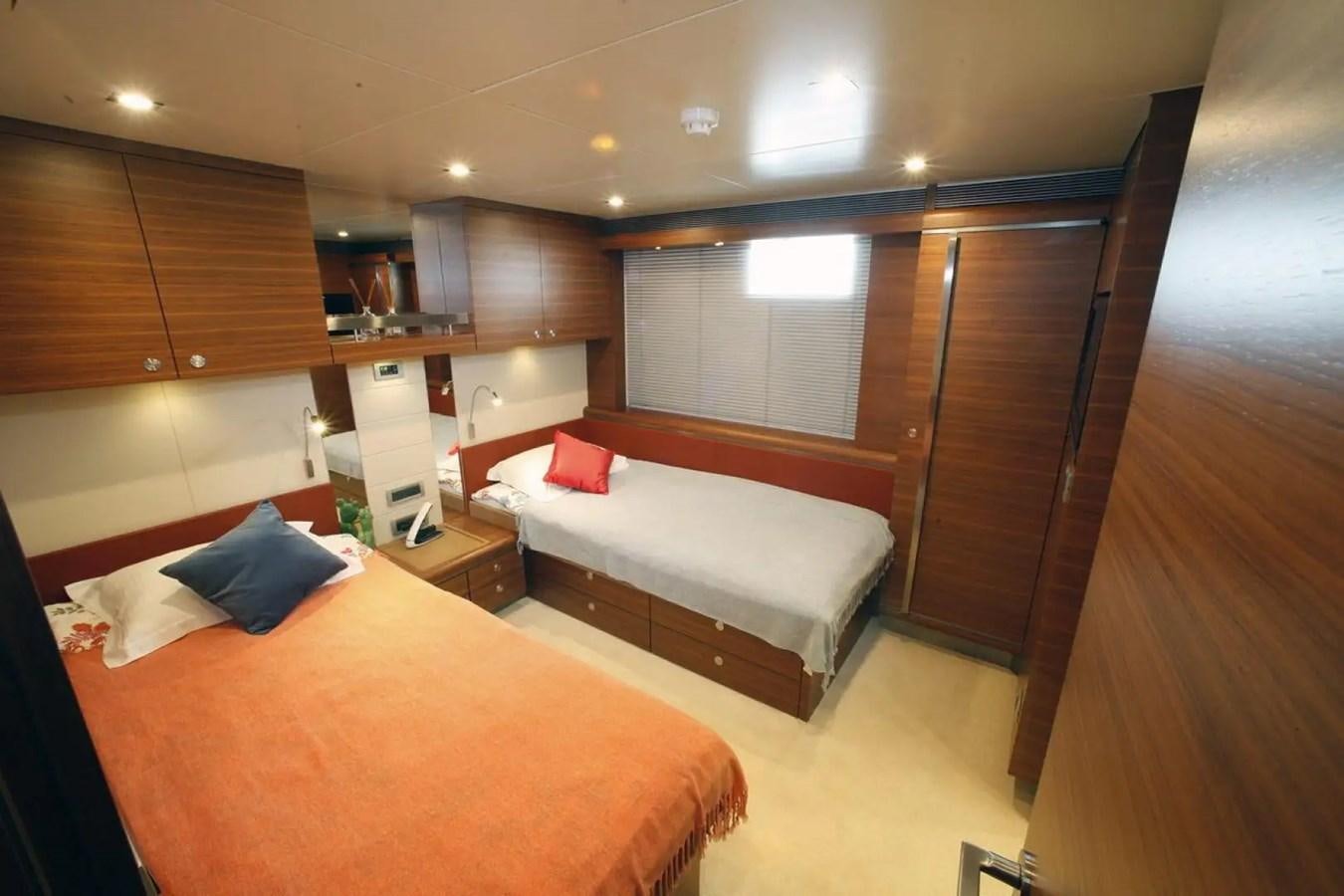 a room with a bed and a chair aboard DELETE MR MOUSE Yacht for Sale