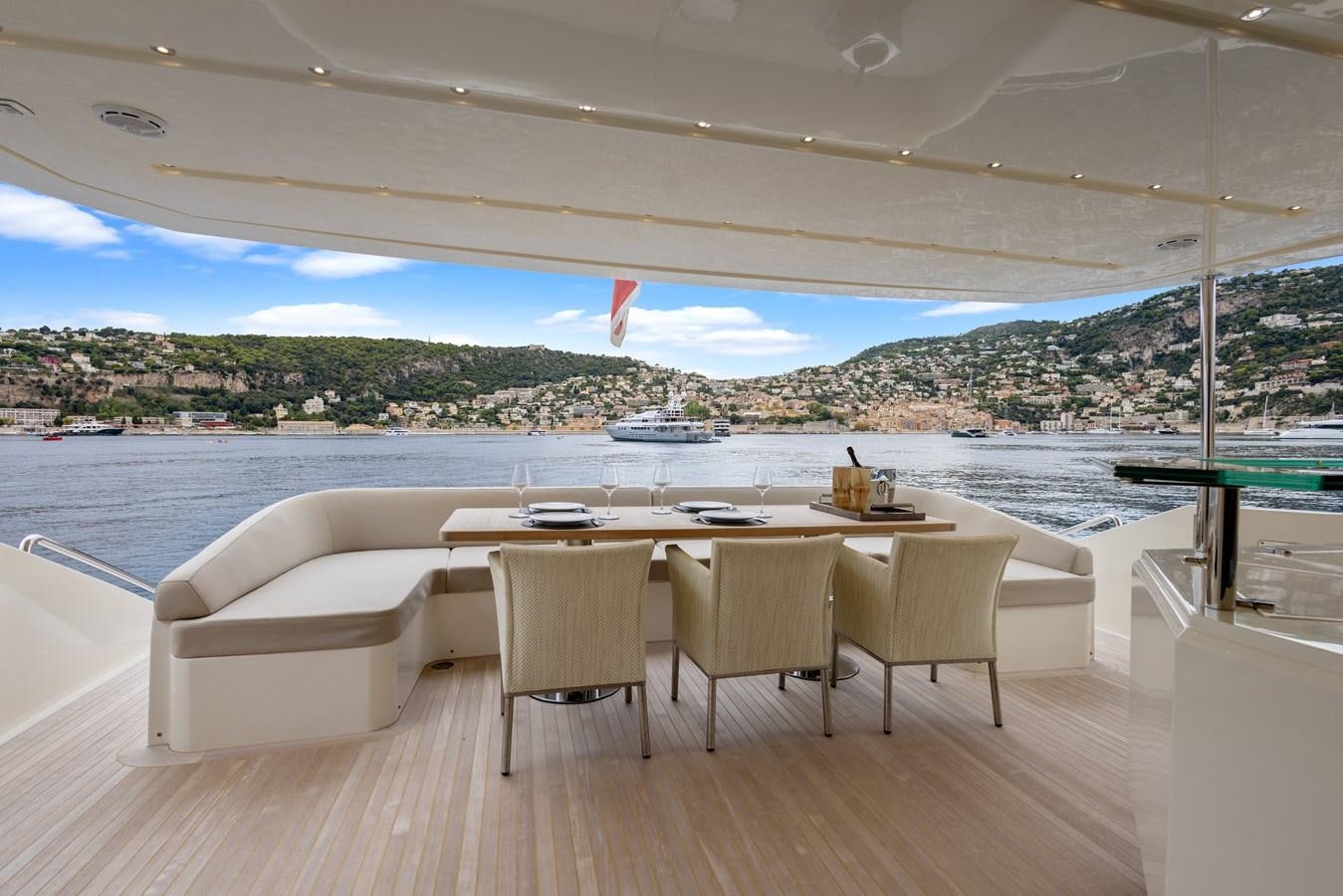 a table and chairs on a deck aboard DEBRA ONE Yacht for Sale